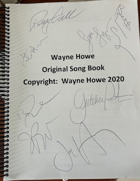 Wayne Howe song book autographed by Rodney Crowell